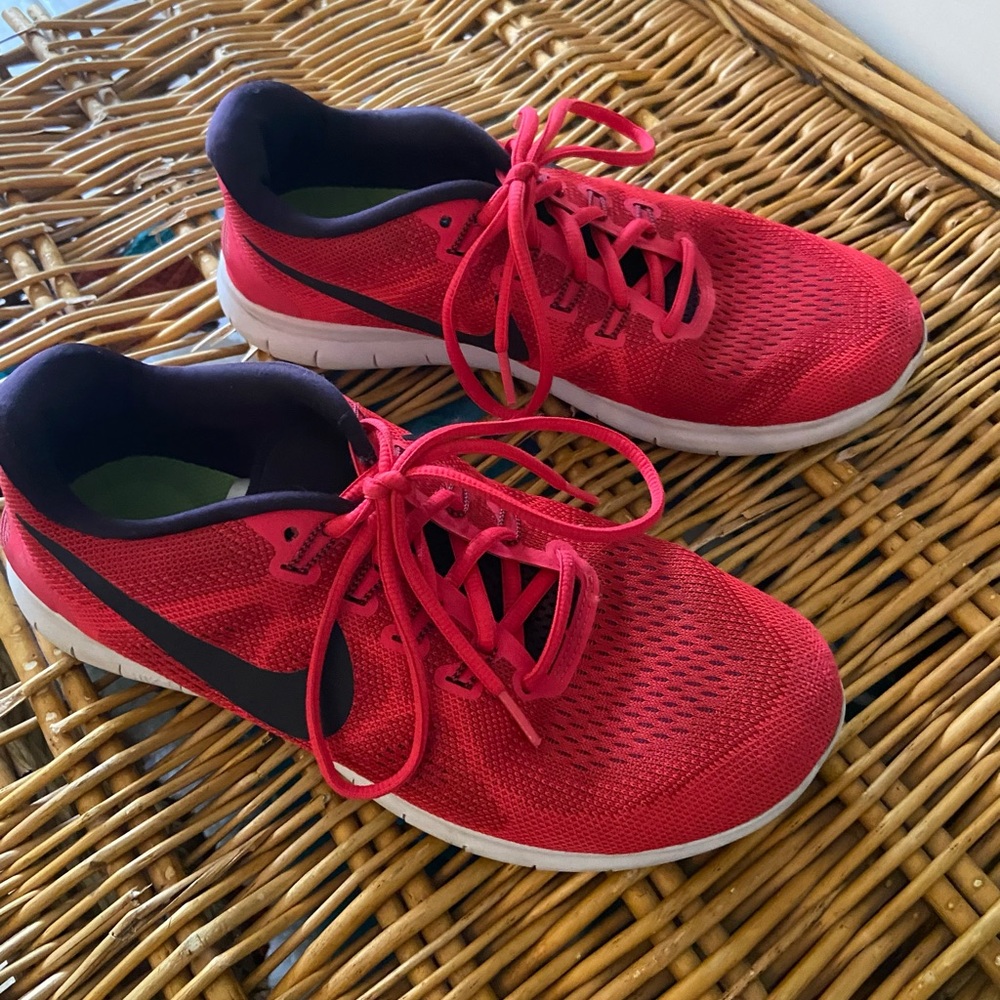 Red Nike tennis shoes